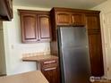 This functional kitchen showcases custom wood cabinets and stainless refrigerator at 4619 Chestnut Ln, Boulder, CO 80301