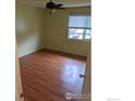 Bedroom features hardwood floors and a window providing natural light at 5124 Williams Fork Trl # 204, Boulder, CO 80301