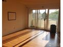 Bright living room with hardwood floors and sliding glass doors to the balcony at 5124 Williams Fork Trl # 204, Boulder, CO 80301
