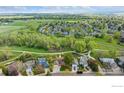 Breathtaking aerial view of the house nestled in a lush neighborhood with mature trees at 536 W Sycamore Cir, Louisville, CO 80027