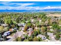 Property aerial view showing home's location in a neighborhood with lush landscaping and mountain views at 7905 Wellshire Ct, Niwot, CO 80503