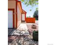 Inviting home exterior with a walkway leading to the front door, complemented by decorative rock landscaping at 1072 Townley Cir, Longmont, CO 80501