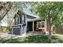 This two-story home has an attached two-car garage, and brick accent, creating a welcoming and functional space at 12506 Maria Cir, Broomfield, CO 80020