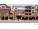 Beautiful brick building with an arched drive-through and elegant architectural details at 1301 Canyon Blvd # 207, Boulder, CO 80302