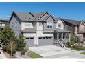 Attractive two-story home with a two-car garage, porch, and beautifully landscaped front yard at 1840 Marquette Dr, Erie, CO 80516