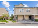 Charming townhome featuring attached garages, neutral siding, and lush landscaping for an inviting curb appeal at 1866 Mallard Dr, Superior, CO 80027