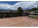 Spacious wooden deck is perfect for entertaining or relaxing while enjoying the picturesque views at 258 Post Boy Rd, Boulder, CO 80302