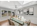 Open dining room with modern decor, a glass table, and a stove next to the window at 258 Post Boy Rd, Boulder, CO 80302