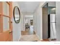 Warm entryway showcasing tiled floors, interior access, and stainless steel appliances at 258 Post Boy Rd, Boulder, CO 80302
