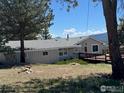 This charming ranch boasts a well-maintained exterior with a cozy deck perfect for enjoying the outdoors at 258 Post Boy Rd, Boulder, CO 80302