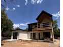 View of a modern home with a spacious deck and outdoor living area. New construction at 2941 21St St, Boulder, CO 80304
