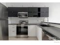 Well-equipped kitchen boasting stainless steel appliances, stylish backsplash, and ample counter space at 3090 W 107Th Pl # C, Westminster, CO 80031