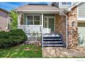 Inviting front entrance featuring a charming porch, stone accents, and well-maintained landscaping at 4856 10Th St, Boulder, CO 80304