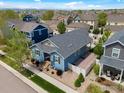 Aerial view of a blue single-Gathering home featuring mature landscaping and a cozy backyard at 569 Jackson St, Lafayette, CO 80026