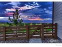 Scenic backyard view featuring a wooden fence and mountain views at 685 Quarry Ct, Erie, CO 80516
