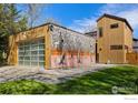 Modern garage with an artistic mural on the exterior, seamlessly blending art and function at 711 Hawthorn Ave, Boulder, CO 80304