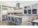 Open kitchen with a large island, modern appliances, and ample natural light at 711 Hawthorn Ave, Boulder, CO 80304