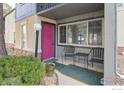 Charming entrance with a vibrant pink door and seating, complete with a neat landscape at 750 W Moorhead Cir # A, Boulder, CO 80305