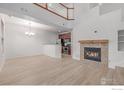 Bright living room with open floor plan, large fireplace, and contemporary design elements at 7777 E 23Rd Ave # 1406, Denver, CO 80238