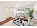 Bright living room featuring hardwood floors, large windows, and modern decor, creating a comfortable space at 812 E Baseline Rd # A, Lafayette, CO 80026