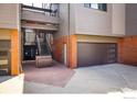 Townhome entryway featuring a garage and staircase to a private entrance at 836 Walnut St # B, Boulder, CO 80302
