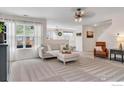 Bright living room with modern decor and large windows at 11040 York St, Northglenn, CO 80233