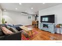 Modern living room features hardwood floors, cozy seating, and stylish decor at 1343 Gay St, Longmont, CO 80501