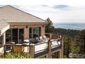 Outdoor deck perfect for entertaining with scenic views, offering ample seating and a barbecue area at 1426 Rembrandt Rd, Boulder, CO 80302