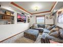 Cozy Gathering room with recessed lighting, a large sectional couch, and a built-in entertainment center at 14531 Country Hills Dr, Brighton, CO 80601