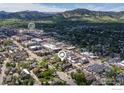 Aerial view showcasing the property's close proximity to Pearl Street Mall and scenic mountains at 1837 Walnut St # E, Boulder, CO 80302
