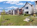 Exterior view showcasing the neighborhood and green space, perfect for community living at 1933 W 165Th Way, Broomfield, CO 80023