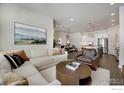 Inviting living room featuring a comfortable sofa and stylish decor, perfect for relaxation at 1933 W 165Th Way, Broomfield, CO 80023