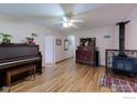 Spacious living room featuring hardwood floors, a wood-burning stove, and an abundance of natural light at 3090 17Th St, Boulder, CO 80304
