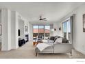 Cozy living room with a fireplace and access to a balcony, ideal for relaxing and entertaining at 4500 Baseline Rd # 4402, Boulder, CO 80303