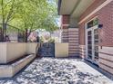 Ground-level entrance with a small patio, stairs, and a partial view of the building at 4585 13Th St # 1-C, Boulder, CO 80304