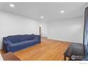 Bright living room featuring hardwood floors, open space for furniture, and recessed lighting at 690 W 1St Ave, Broomfield, CO 80020