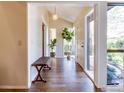 Bright and inviting foyer with wood floors, modern lighting, and a glimpse of the outdoors at 700 Poplar Ave, Boulder, CO 80304