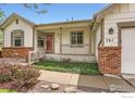 Inviting front porch with a charming entrance and well-maintained landscaping at 741 Hallmark Ln, Longmont, CO 80504