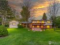 Spacious backyard features a patio with pergola, perfect for outdoor entertaining at 11361 Flatiron Dr, Lafayette, CO 80026