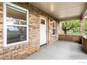 Inviting covered front porch offering a welcoming entrance to this charming home at 120 E Nebraska Ave, Berthoud, CO 80513