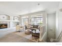 Inviting living room with neutral tones and lots of natural light next to stairs at 12711 Colorado Blvd # H-804, Thornton, CO 80241