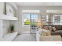 Cozy living room with sliding doors and a view to the outside balcony at 12711 Colorado Blvd # H-804, Thornton, CO 80241