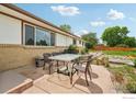 Charming patio area with outdoor seating, perfect for relaxing and entertaining friends and Gathering at 12734 Anhawa Ave, Longmont, CO 80503