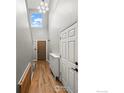 Bright foyer with hardwood floors, high ceilings, and a stylish light fixture at 2002 E 102Nd Cir, Thornton, CO 80229