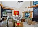 Bright living room features a wood burning fireplace and comfortable seating arrangement at 229 Albion St, Denver, CO 80220