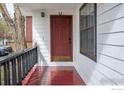 Inviting front porch with painted wood flooring, and a horseshoe above the front door at 2315 Walnut St, Boulder, CO 80302