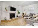 Bright living room with a fireplace, light wood floors, and comfortable seating at 2315 Walnut St, Boulder, CO 80302