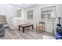 Inviting living room with staircase, offering neutral decor, lots of light, and stylish flooring at 2317 Walnut St, Boulder, CO 80302