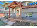 Inviting front porch with wood detail and landscaping at 2550 Woodstock Pl, Boulder, CO 80305