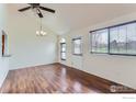 Inviting living room features vaulted ceiling and lots of natural light at 305 S Taft Ct, Louisville, CO 80027
